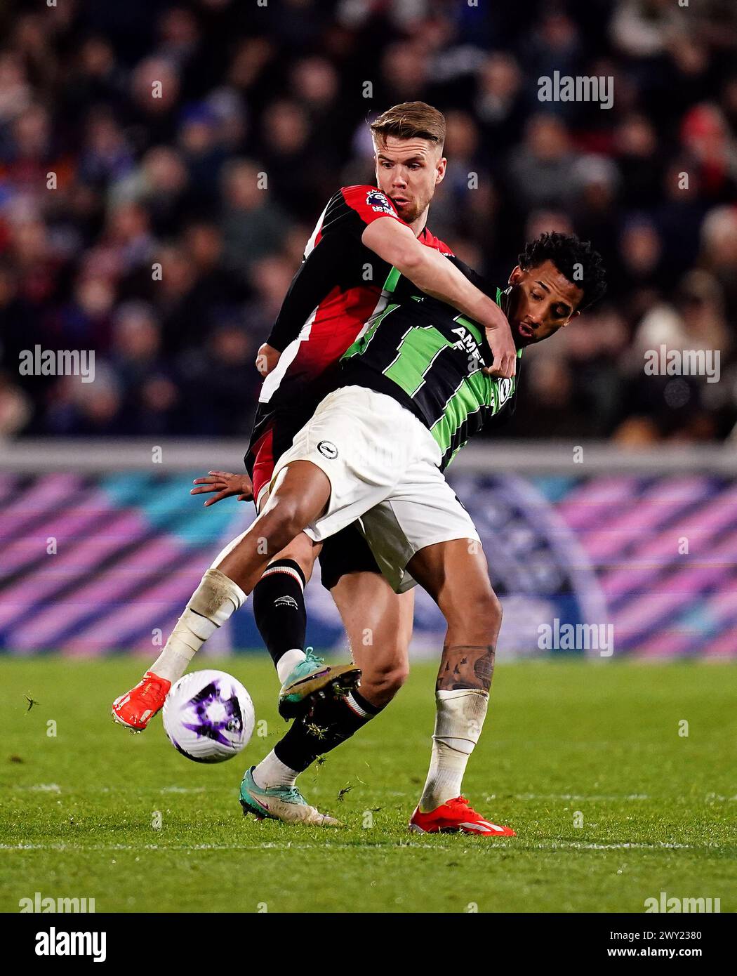 Brentford's Kristoffer Ajer and Brighton and Hove Albion's Joao Pedro