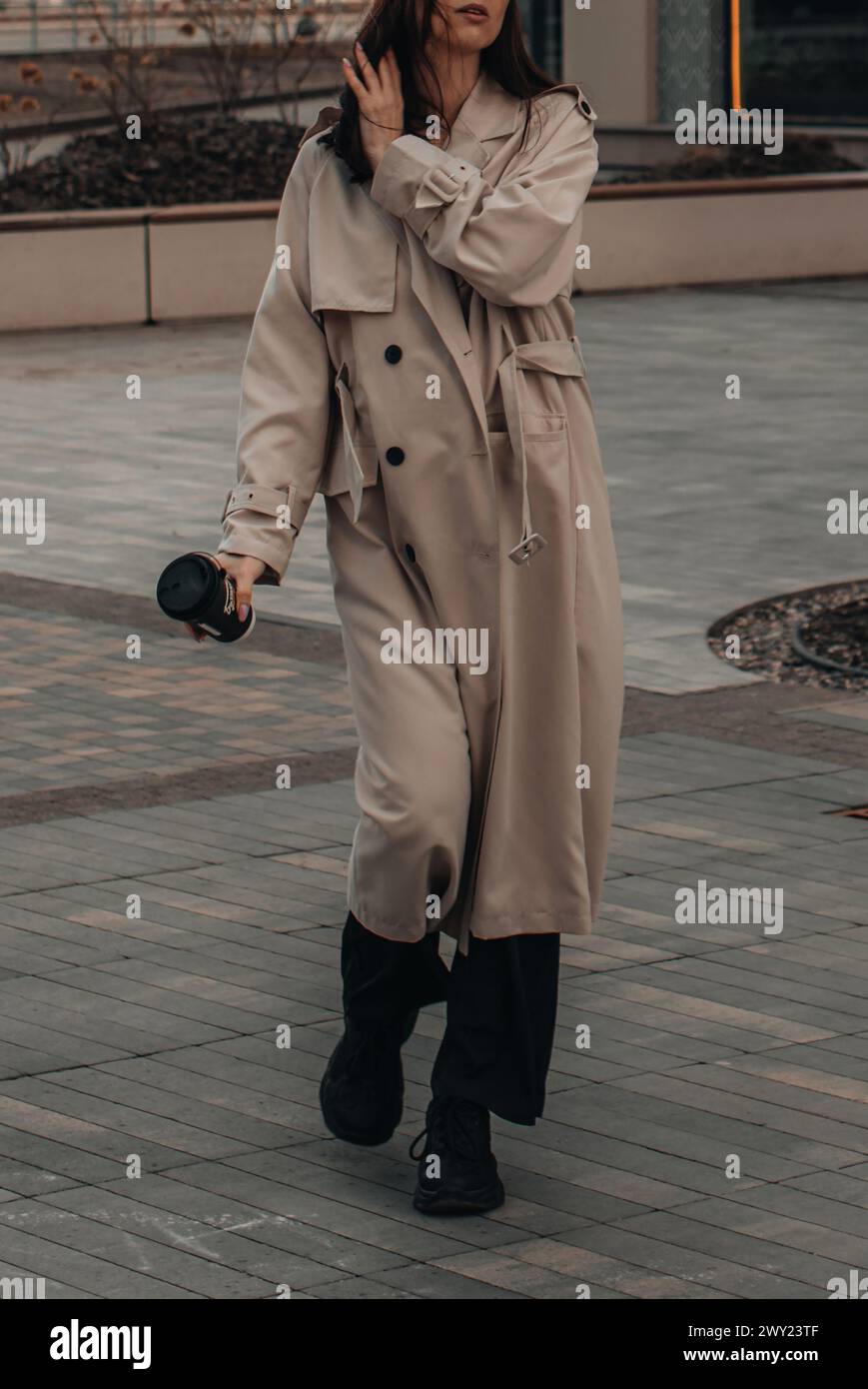 Long beige trench coat hi-res stock photography and images - Alamy