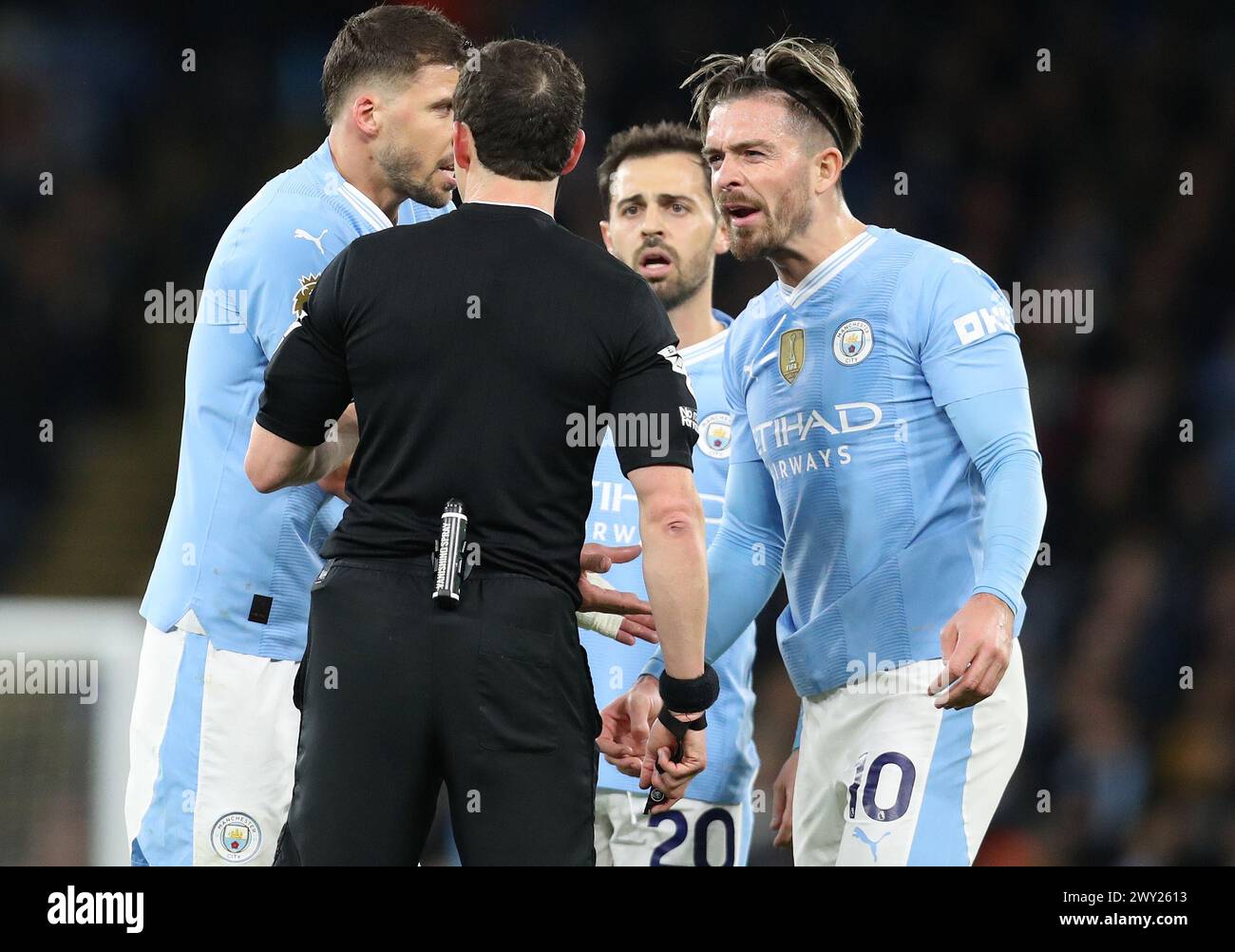 Etihad Stadium, Manchester, UK. 3rd Apr, 2024. Premier League Football, Manchester City versus Aston Villa; Jack Grealish of Manchester City is shown a yellow card for dissent by referee Darren England Credit: Action Plus Sports/Alamy Live News Stock Photo