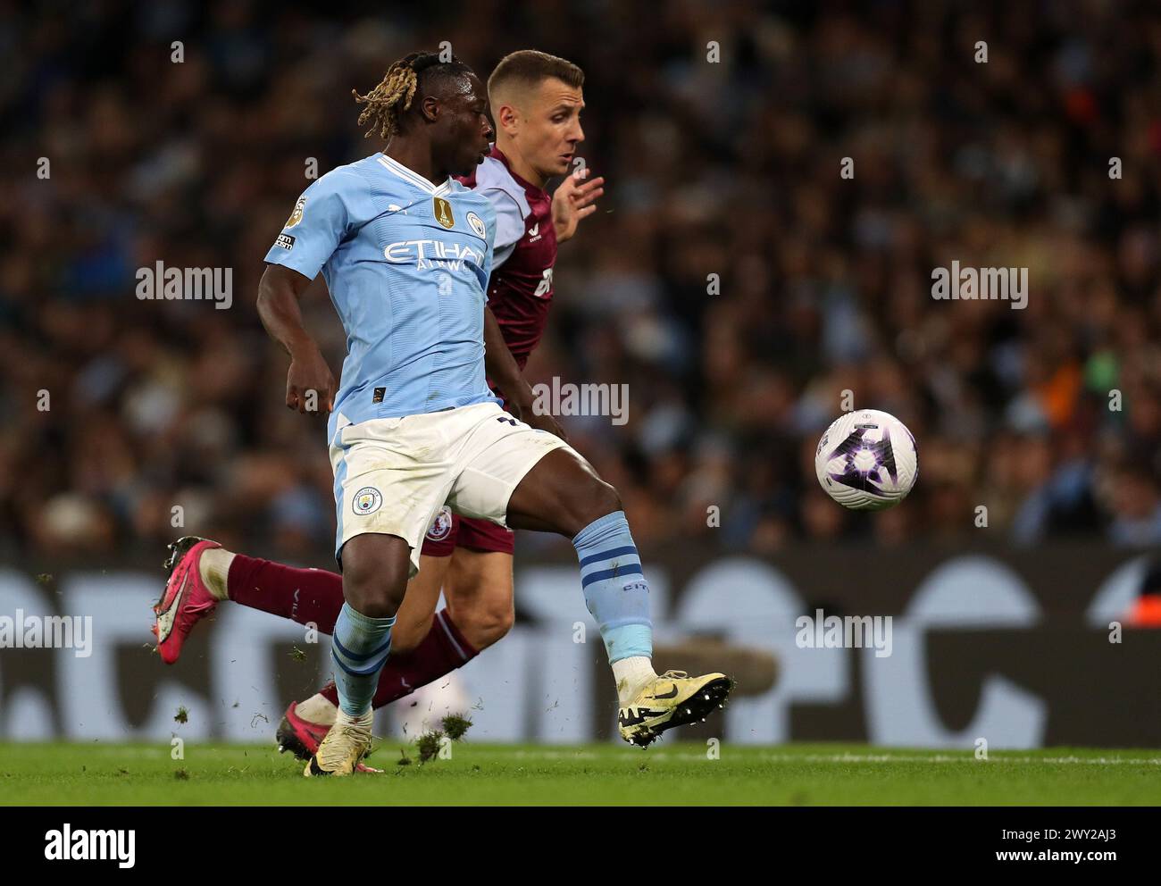 Etihad Stadium, Manchester, UK. 3rd Apr, 2024. Premier League Football, Manchester City versus Aston Villa; Jeremy Doku of Manchester City and Lucas Digne of Aston Villa compete for the ball Credit: Action Plus Sports/Alamy Live News Stock Photo