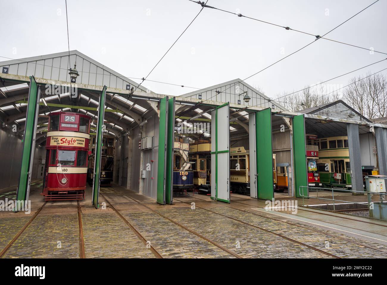 Tram shed full of old vehicles at the National Tramway Museum near Matlock, Derbyshire in April 2024. Stock Photo