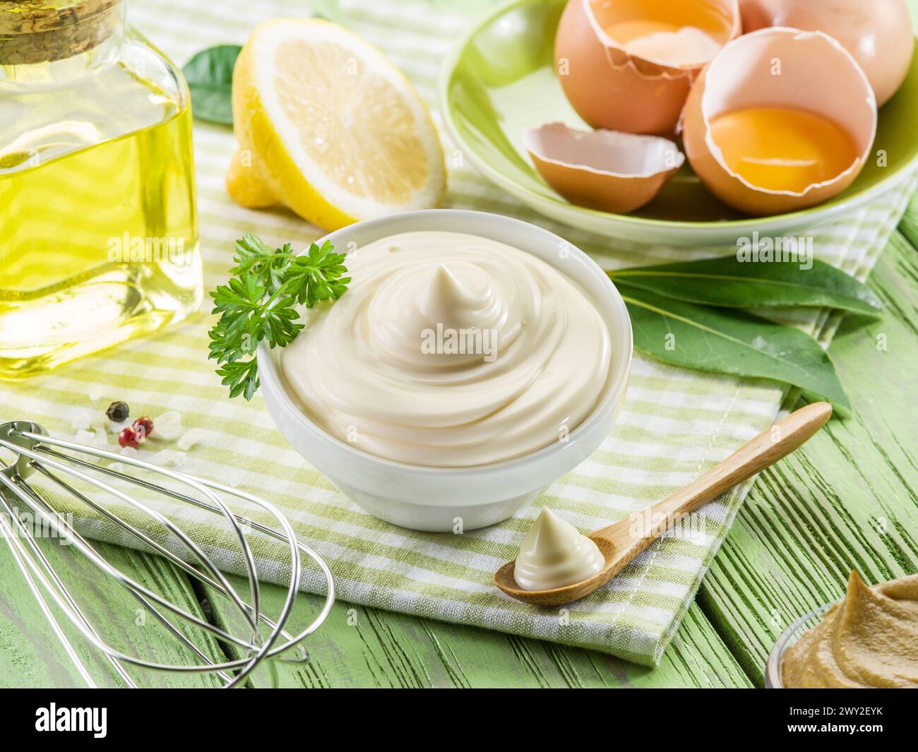 Homemade mayonnaise with ingredients and herbs. Stock Photo