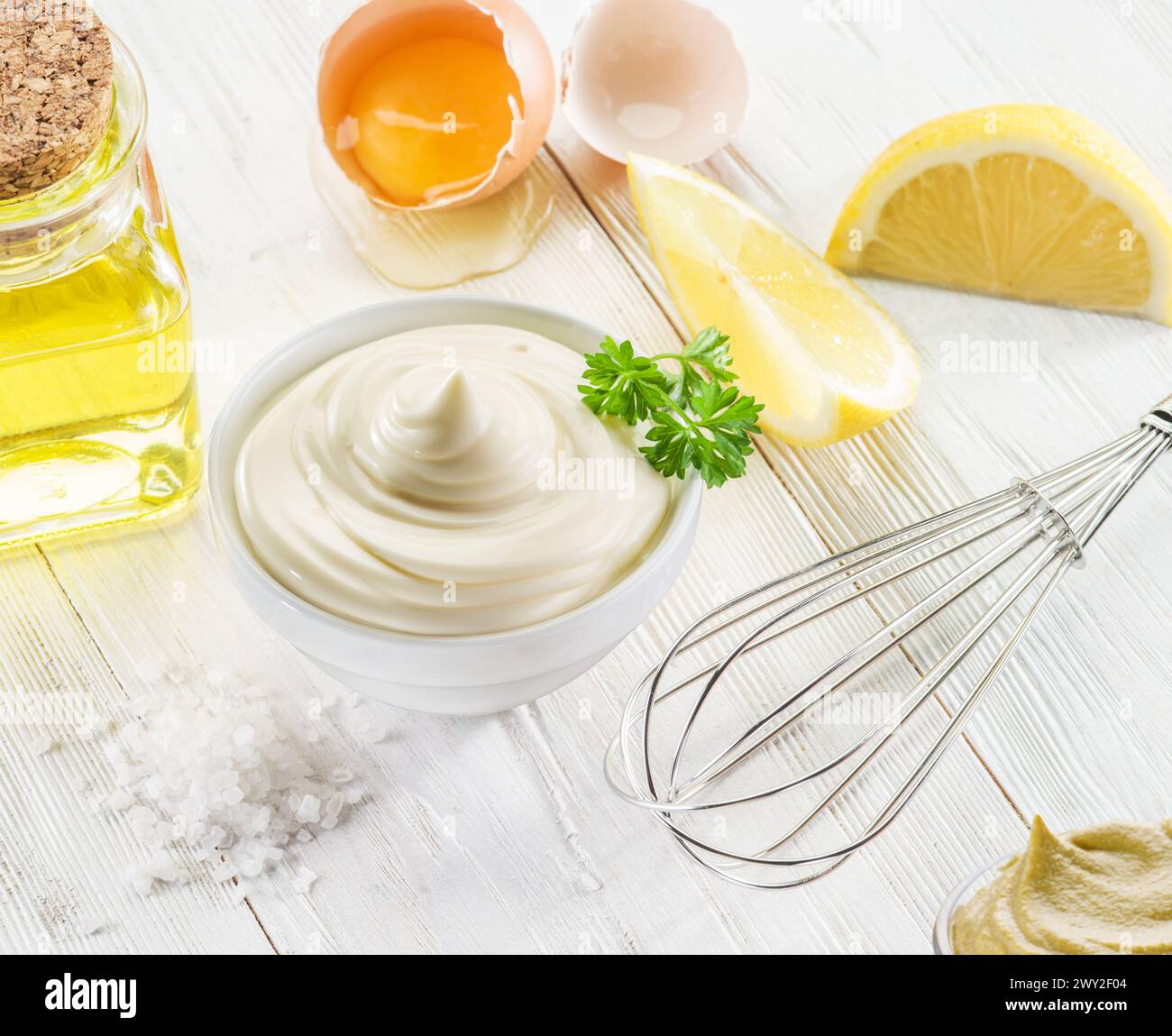 Homemade mayonnaise with ingredients and herbs. Stock Photo
