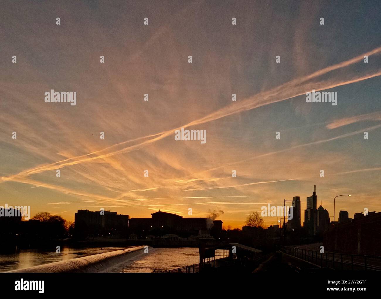 The sun rises over the Philadelphia Museum of Art, as seen from the Fairmount Dam along Martin Luther King Jr. Drive. Stock Photo