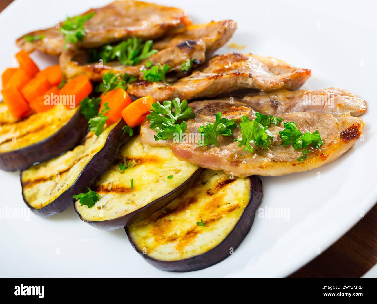 Broiled lamb loin chops with eggplant Stock Photo - Alamy