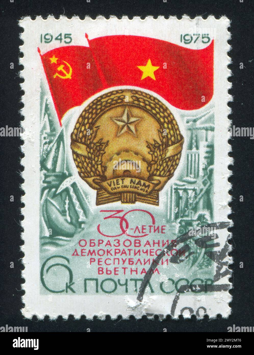 RUSSIA - CIRCA 1975: stamp printed by Russia, shows Flags of USSR, North Vietnam, arms of N.V., industrial development, circa 1975 Stock Photo