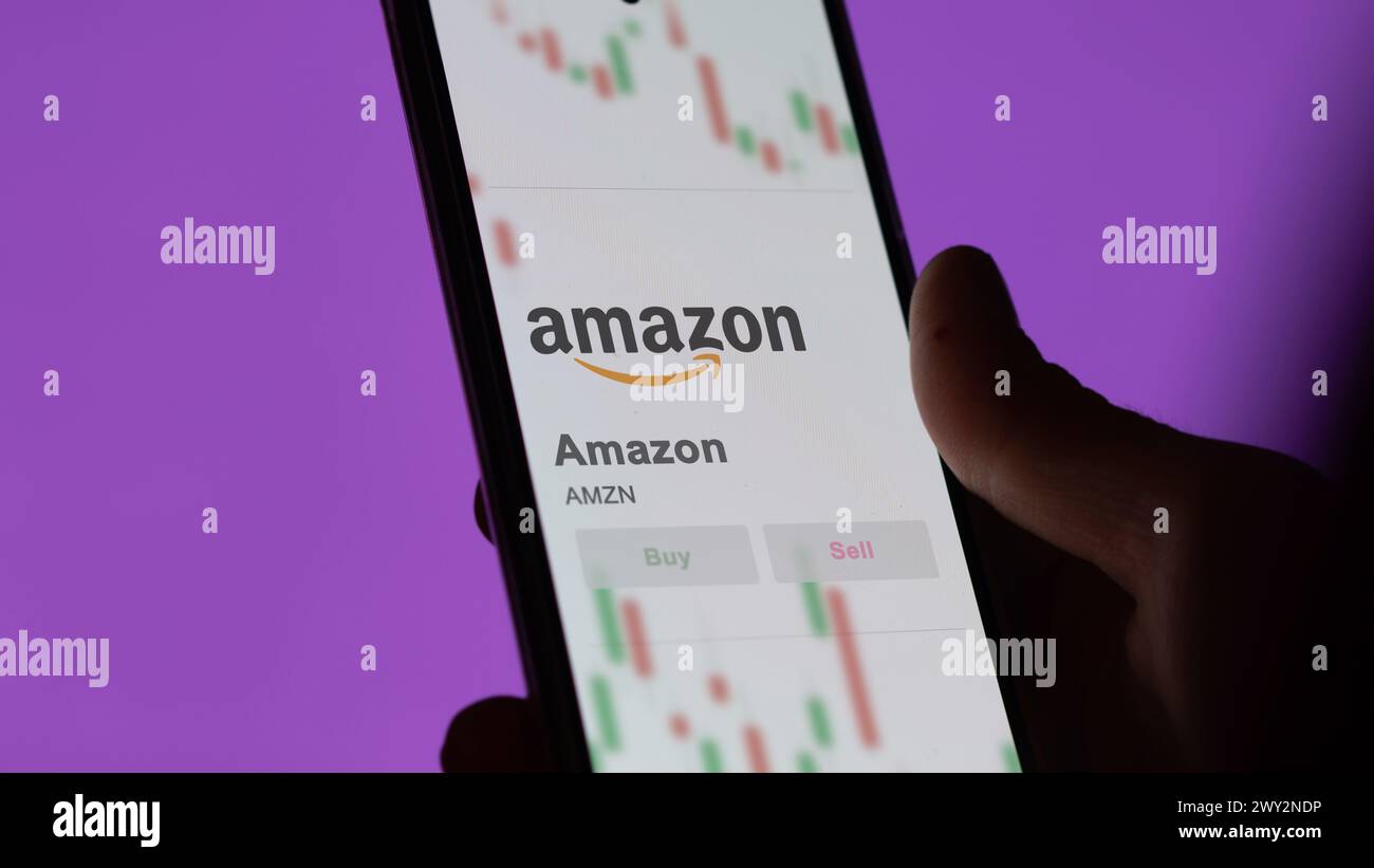 Close up on logo of Amazon on the screen of an exchange. Amazon price stocks, $AMZN on a device. Stock Photo