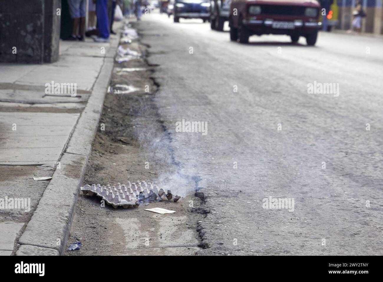 Cardboard burning in city street, Havana, Cuba Stock Photo