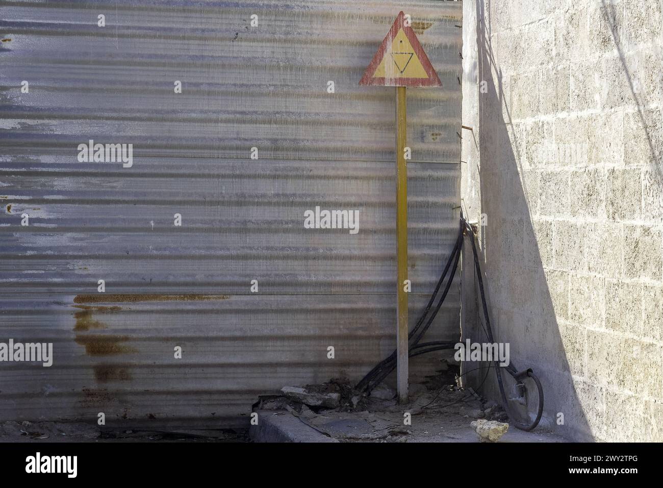 Metal fence by a wall, construction site, Havana, Cuba Stock Photo