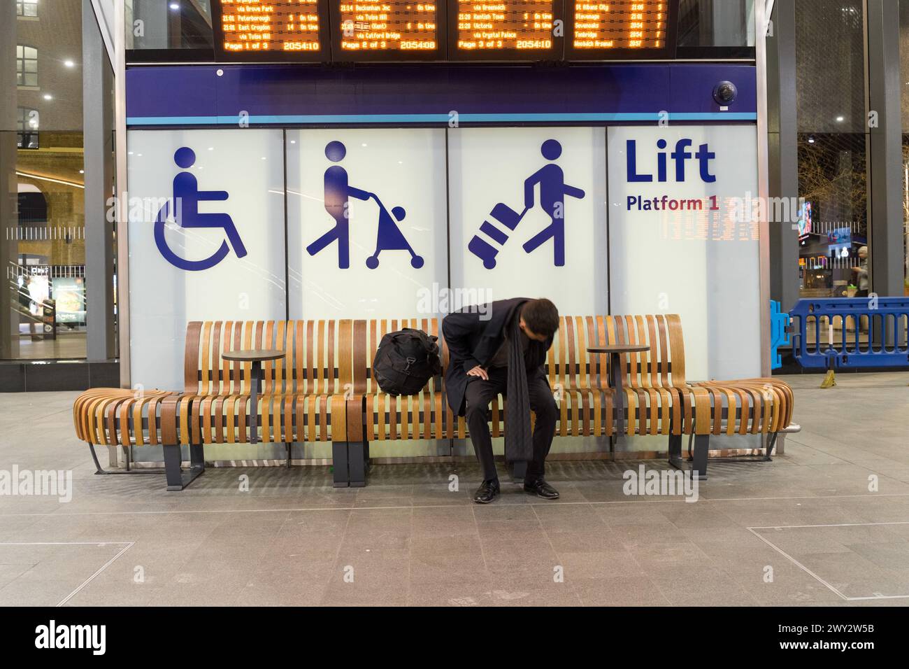 Signage for priority seating arrangement for people with disability, carrying push chair or luggage at London Bridge railway station. UK Stock Photo