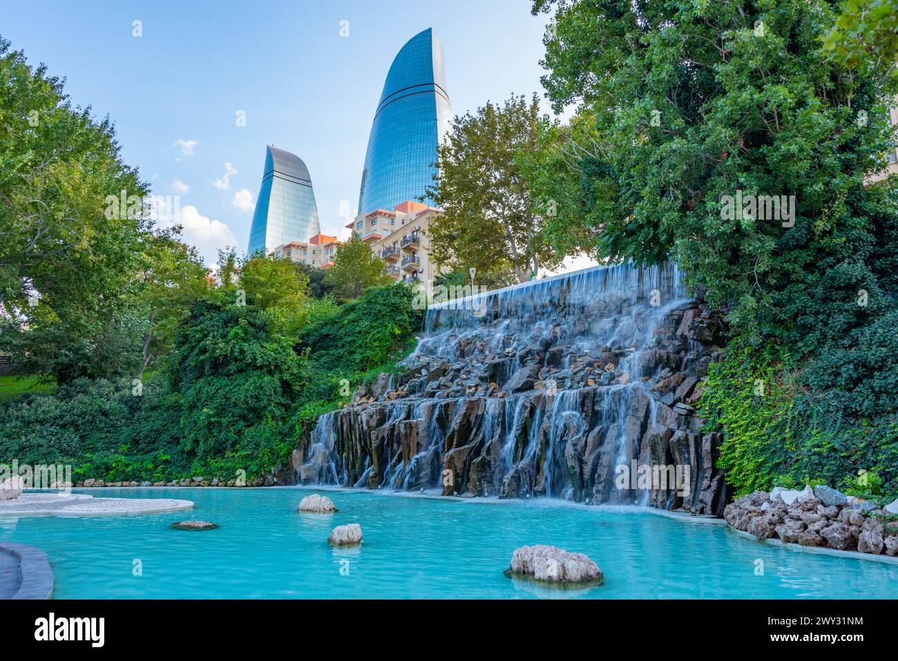 Flame towers viewed behind waterfall at selale park in Baku, Azerbaijan Stock Photo