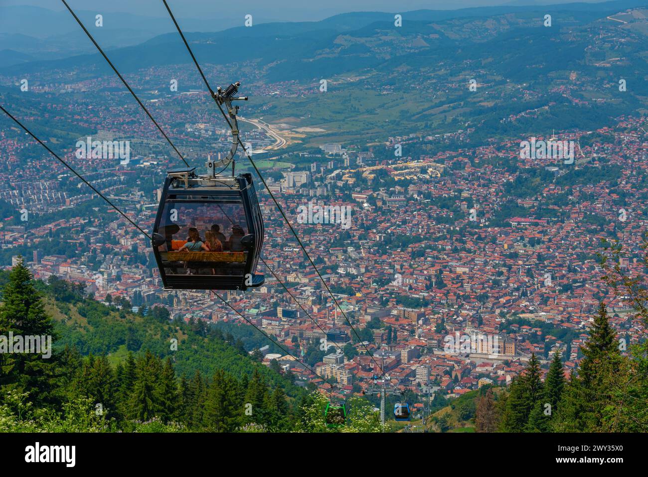 Trebevic gondola raising from the old town of Sarajevo, Bosnia and ...