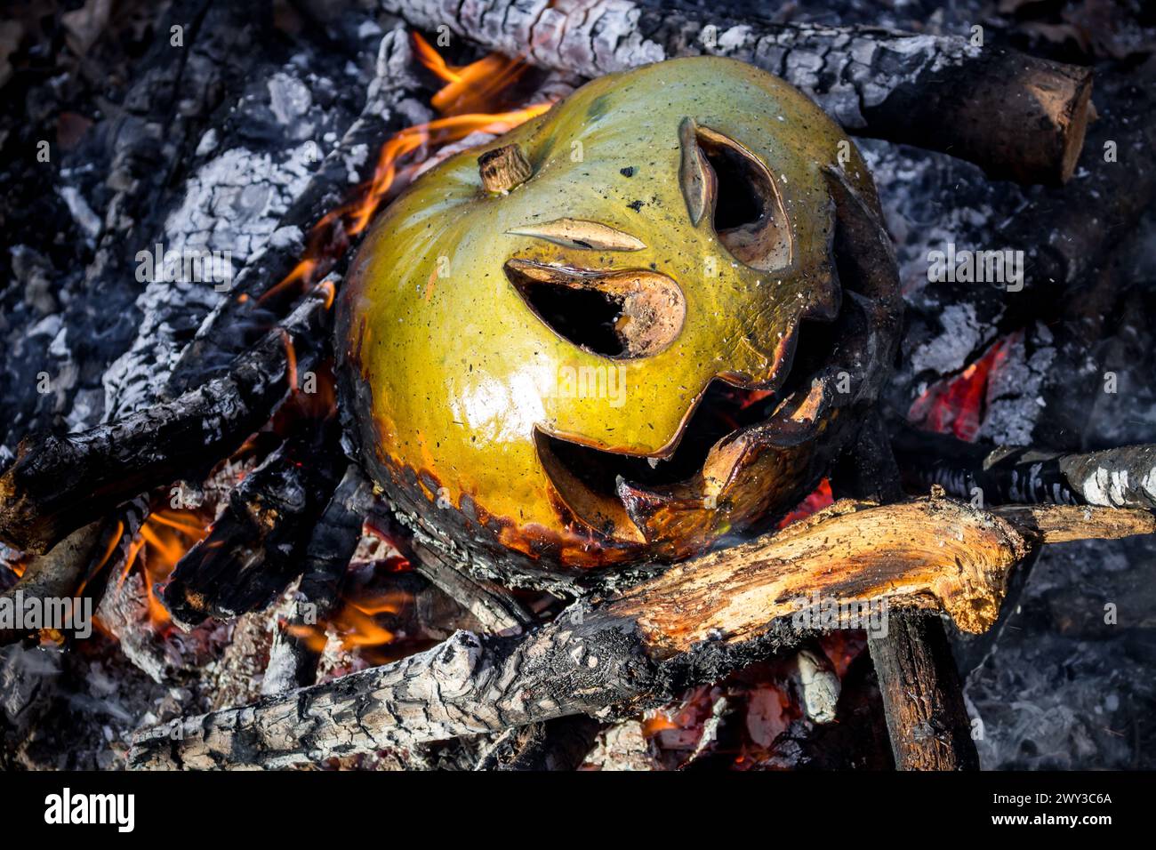 Jack-o'-lantern from pumpkin in the bonfire after Halloween, close Stock Photo