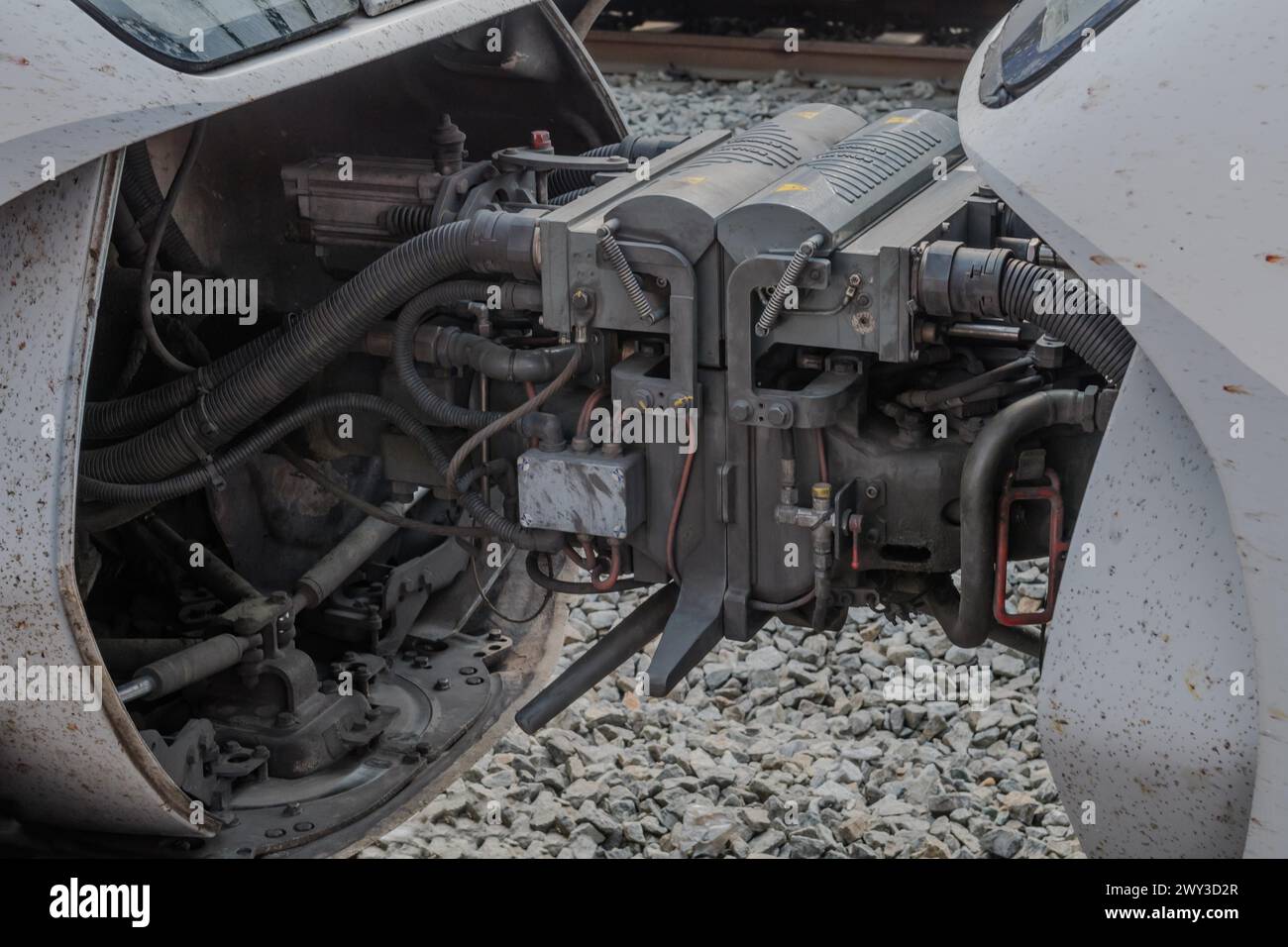 Complex machinery and hoses visible on a train engine's underside, in South Korea Stock Photo