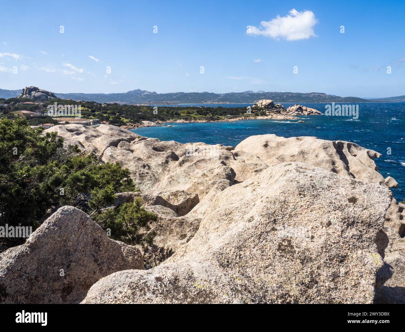 Typical granite rock formations in front of a bay, Baja Sardinia, Costa ...