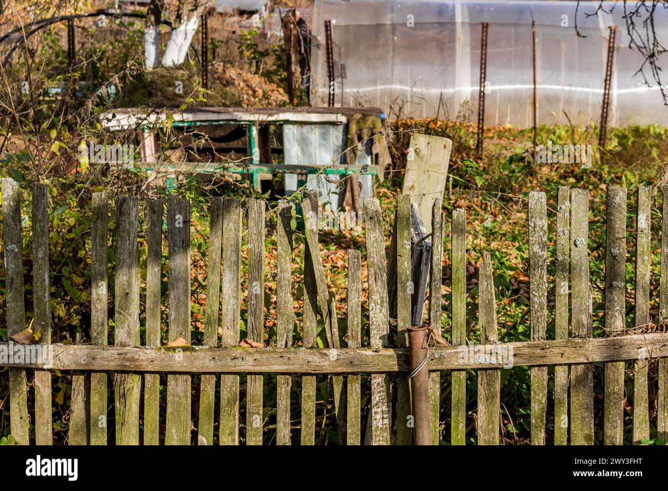 Old rural fence between the gardens Stock Photo - Alamy