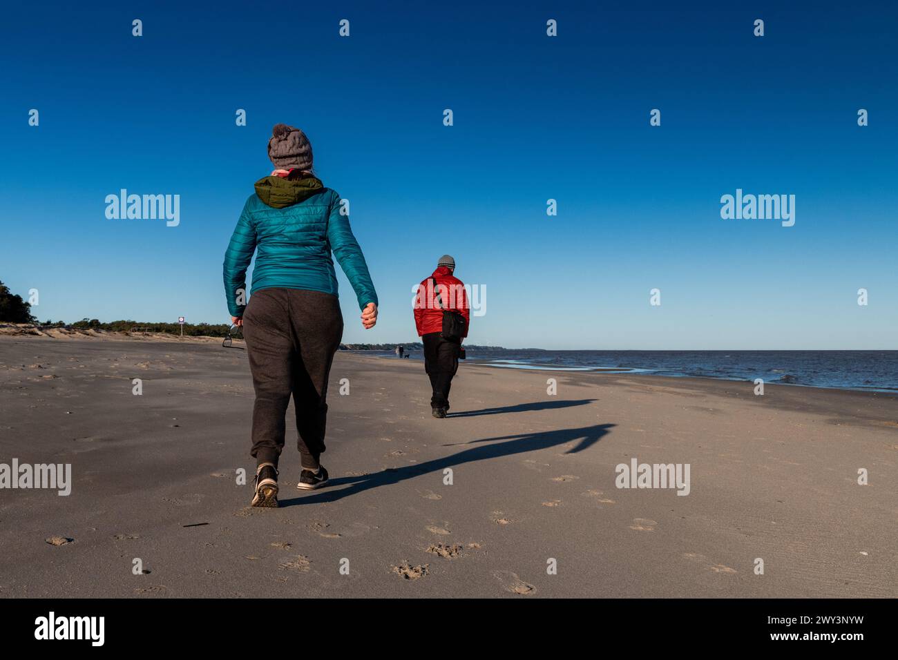 Person wearing red jacket hi-res stock photography and images - Alamy