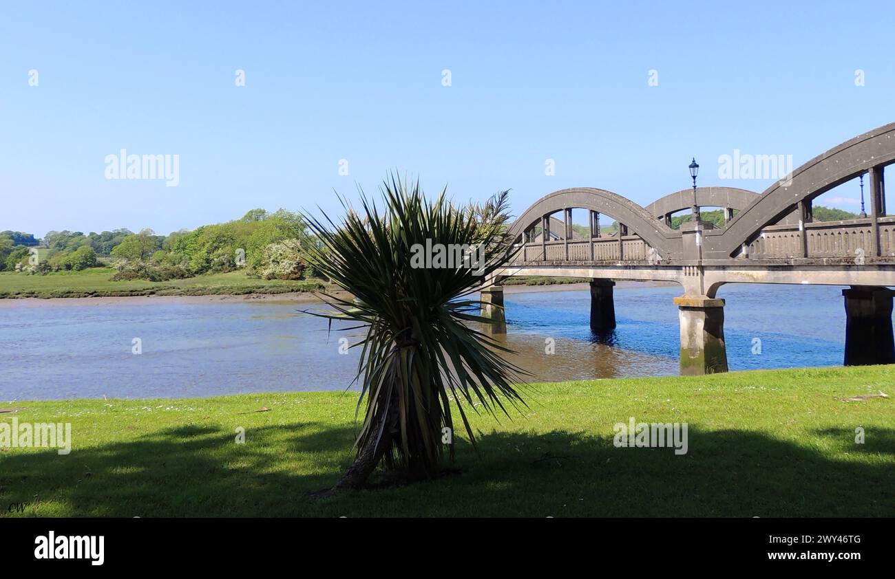 River Dee bridge  at Kirkcudbright was built in 1926 by the engineers Mouchel. It replaced similar arched bridge  made of wrought iron  with six spans  built in 1868.  The present bridge has retained the original  ornate lamp columns . Stock Photo