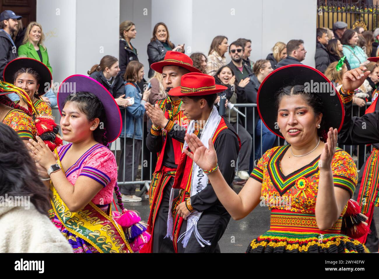 Bolivian dancers in brightly coloured costumes taking part in the procession at the St Patrick's Day parade in London. Stock Photo