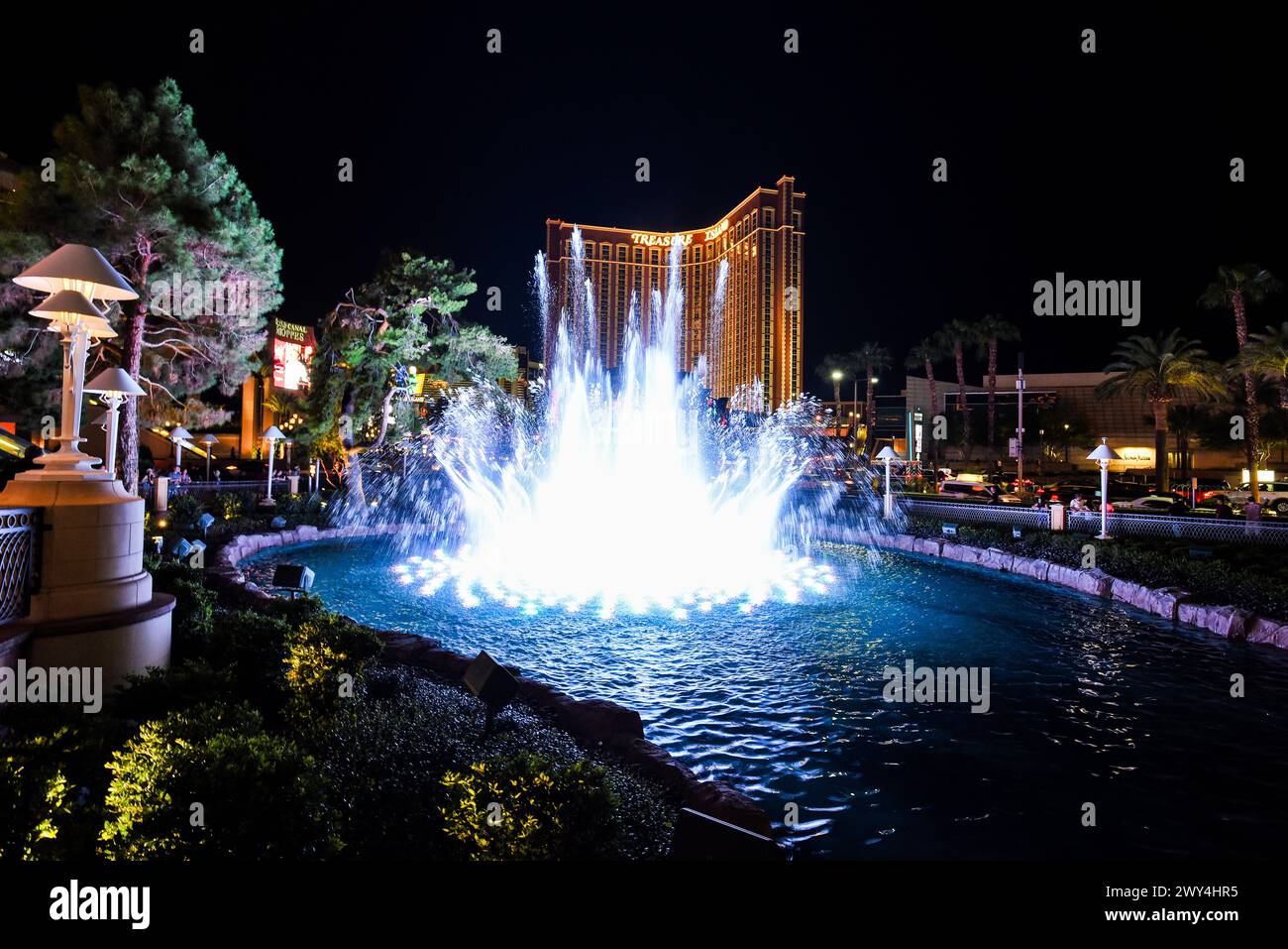 The Wynn Fountain Show with the Treasure Island Hotel in the Background - Las Vegas, Nevada Stock Photo
