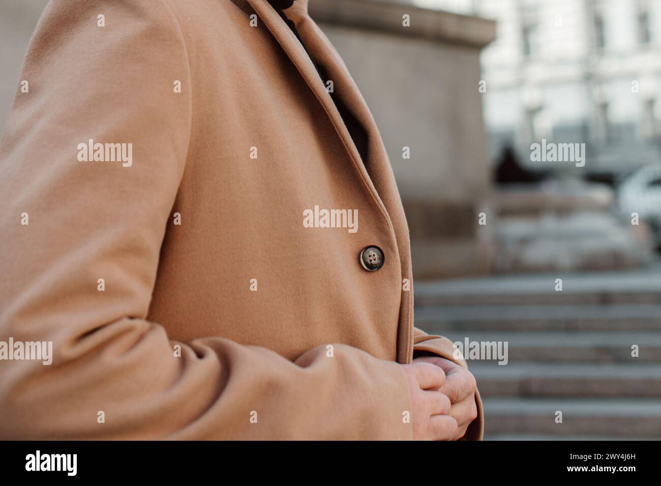 Details of beige brown men's coat. Classic street outerwear Stock Photo