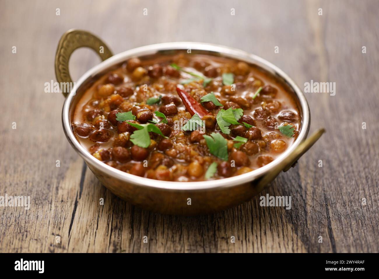 Kala chana masala, Indian-style black chickpea curry. vegetarian food. Stock Photo