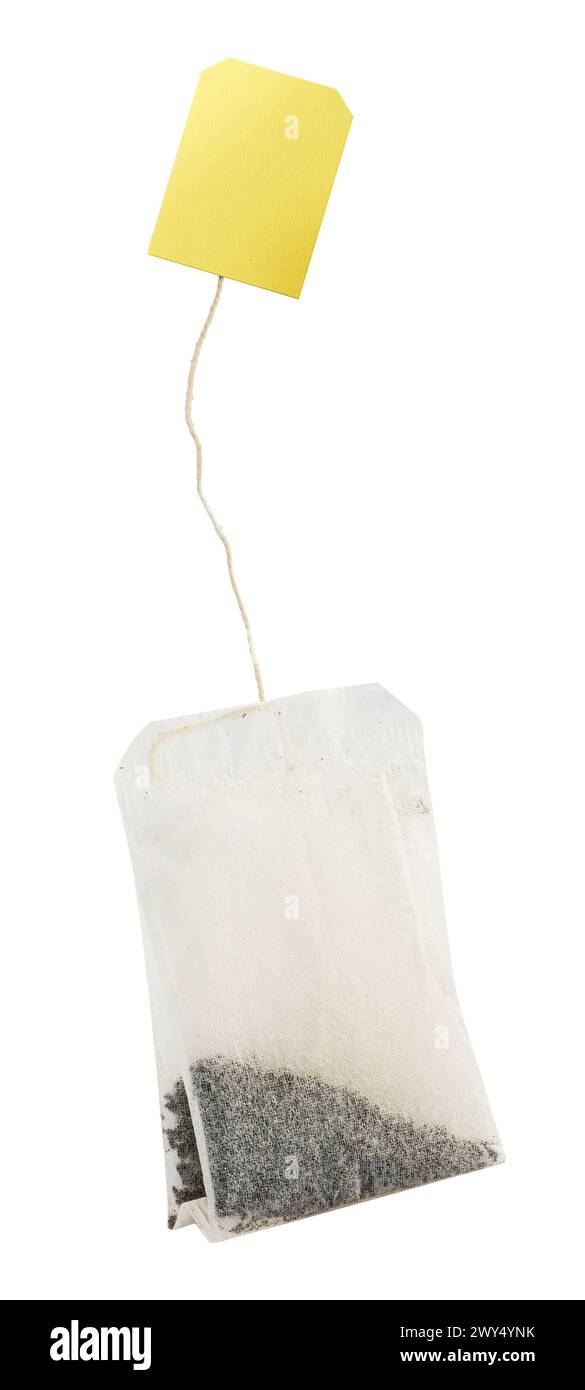 Rectangular shaped tea bag with string and yellow paper label. File contains clipping path. Stock Photo