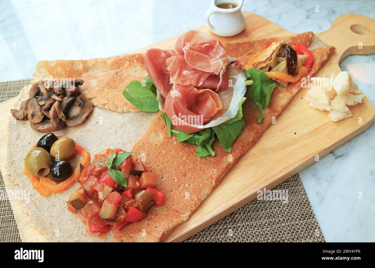 Appetizer Crepe or Crepe Antipasto with cold cuts and variety of saute