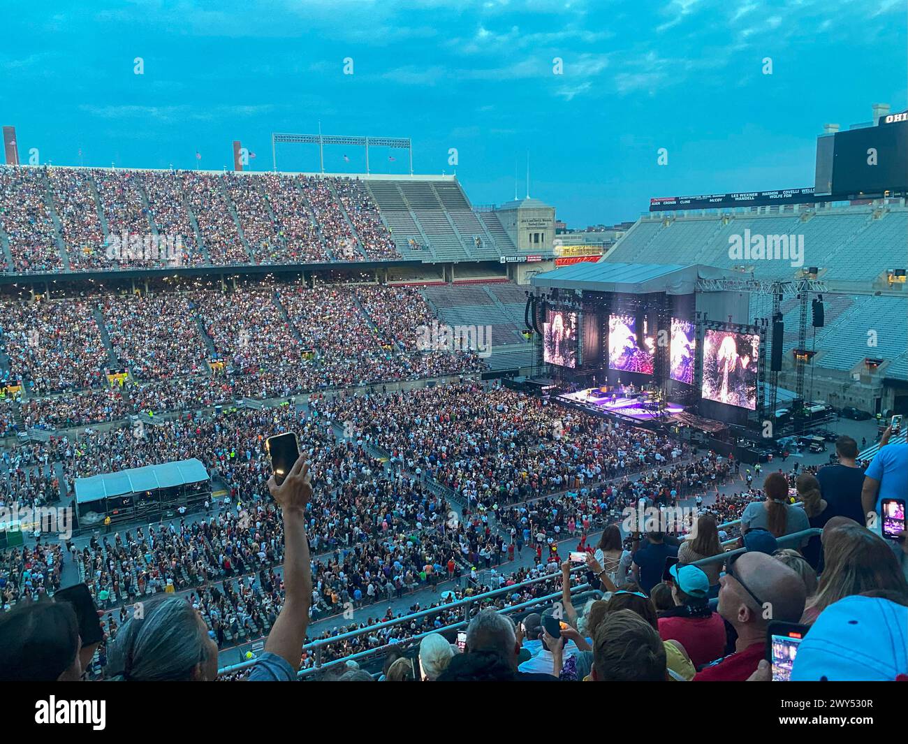 Columbus, Ohio, USA - 5 August 2023: People enjoying a concert in the Ohio State Football Stadium in the early evening. Stock Photo