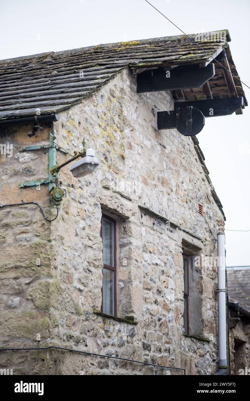Pulley system hoist, or remnants of in some cases, are quirky features of some Settle (North Yorkshire) properties enabling lifting to the upper floor Stock Photo