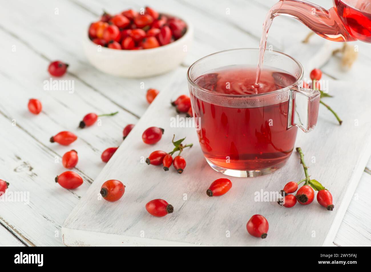rosehip-glass-cup-of-herbal-tea-medicinal-plants-with-rosehip-fruits-on