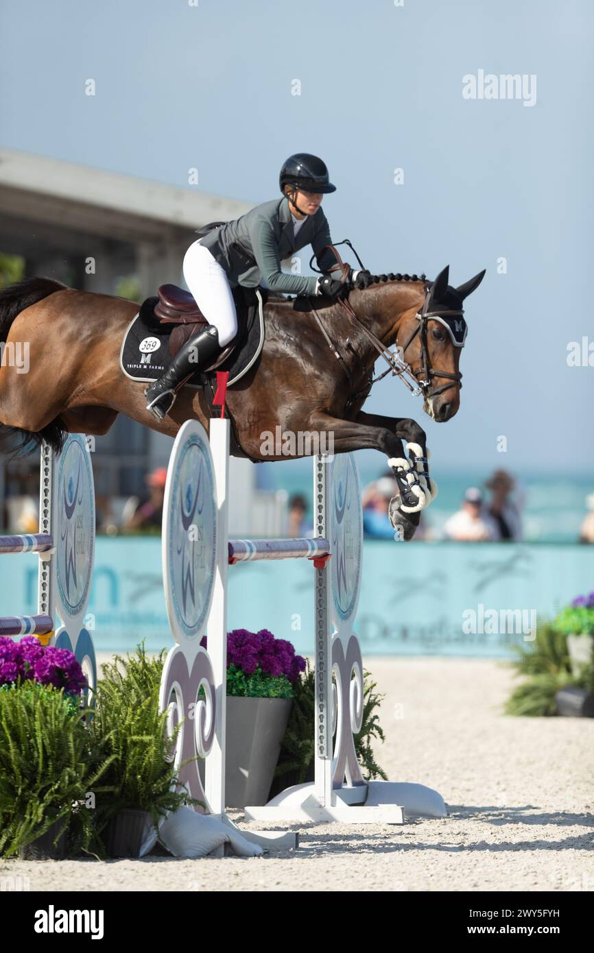 Miami Beach, USA - April 3, 2024. Hailey Royce of the USA and riding Ogue Ardkyle competes during the 1.40 Speed Class at Longines GCL Miami. Stock Photo