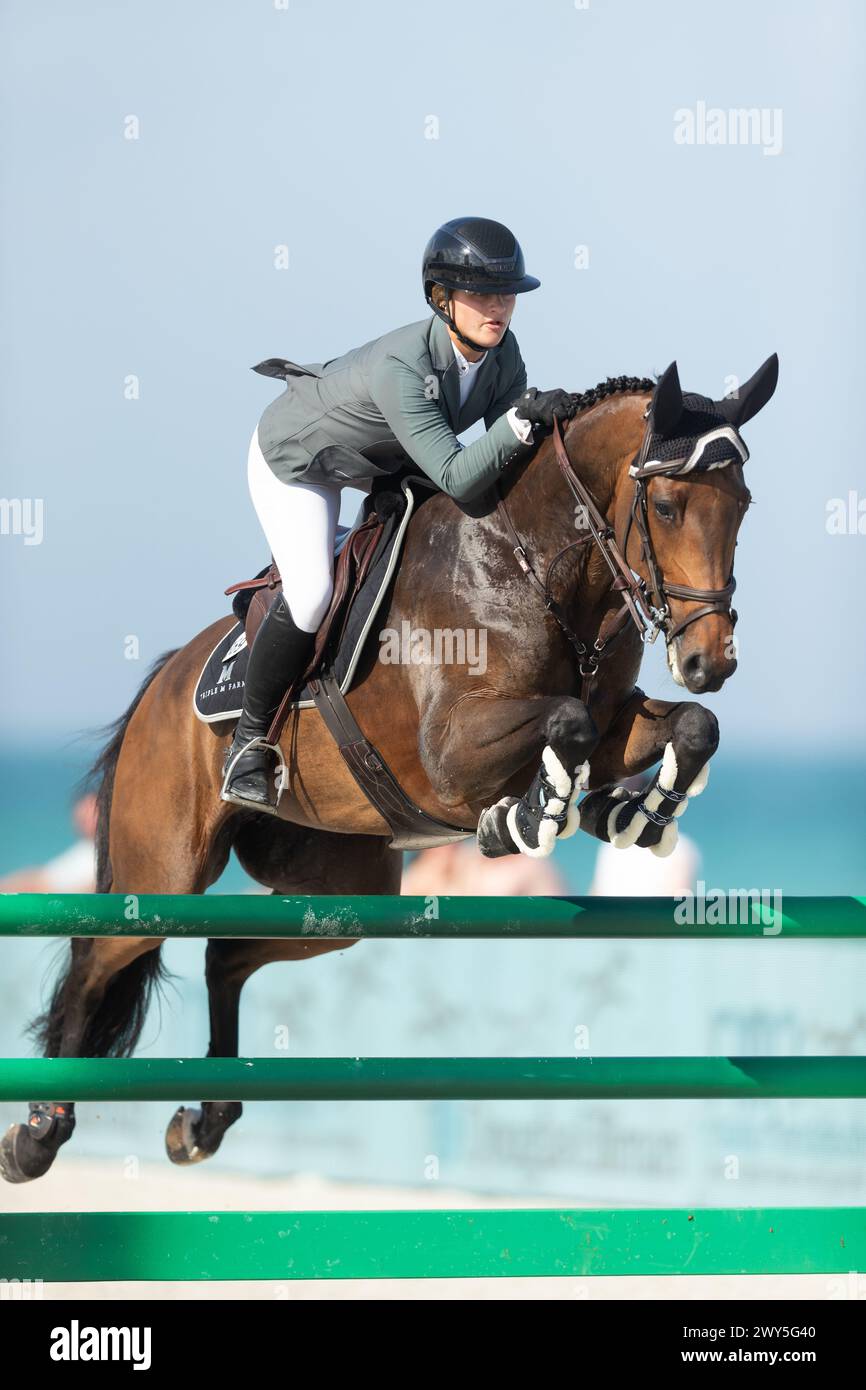 Miami Beach, USA - April 3, 2024. Hailey Royce of the USA and riding Ogue Ardkyle competes during the 1.40 Speed Class at Longines GCL Miami. Stock Photo