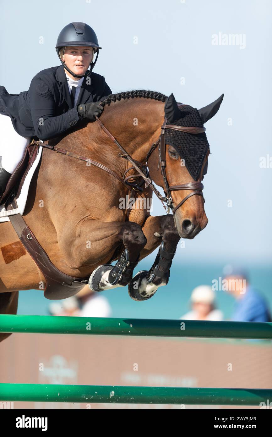 Miami Beach, USA - April 3, 2024. Samantha Schaefer and riding Fraiser competes during the 1.40 Speed Class at Longines GCL Miami. Stock Photo