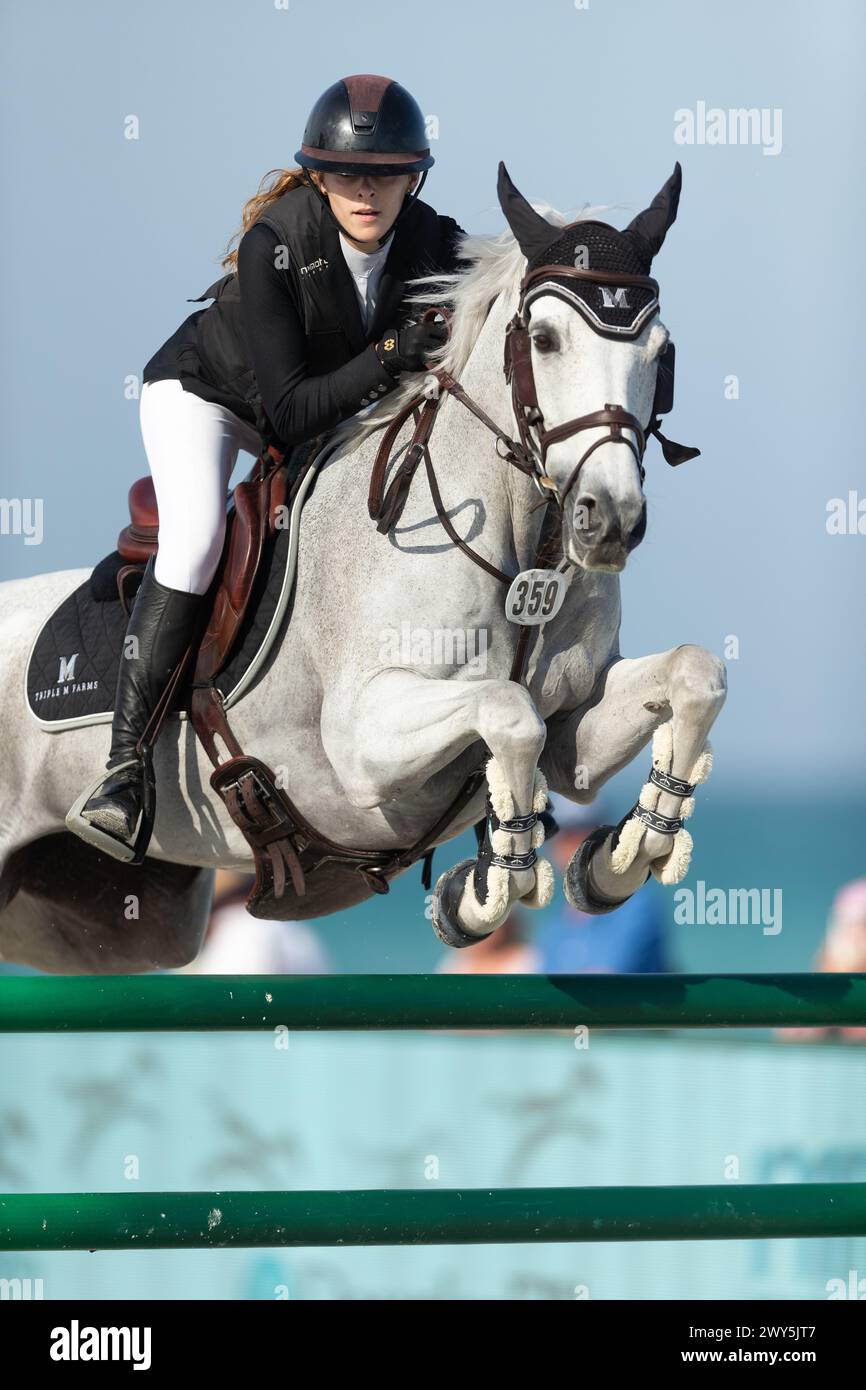 Miami Beach, USA - April 3, 2024. Caroline Mawhinney of the USA and riding Stella Levista competes during the 1.40 Speed Class at Longines GCL Miami. Stock Photo