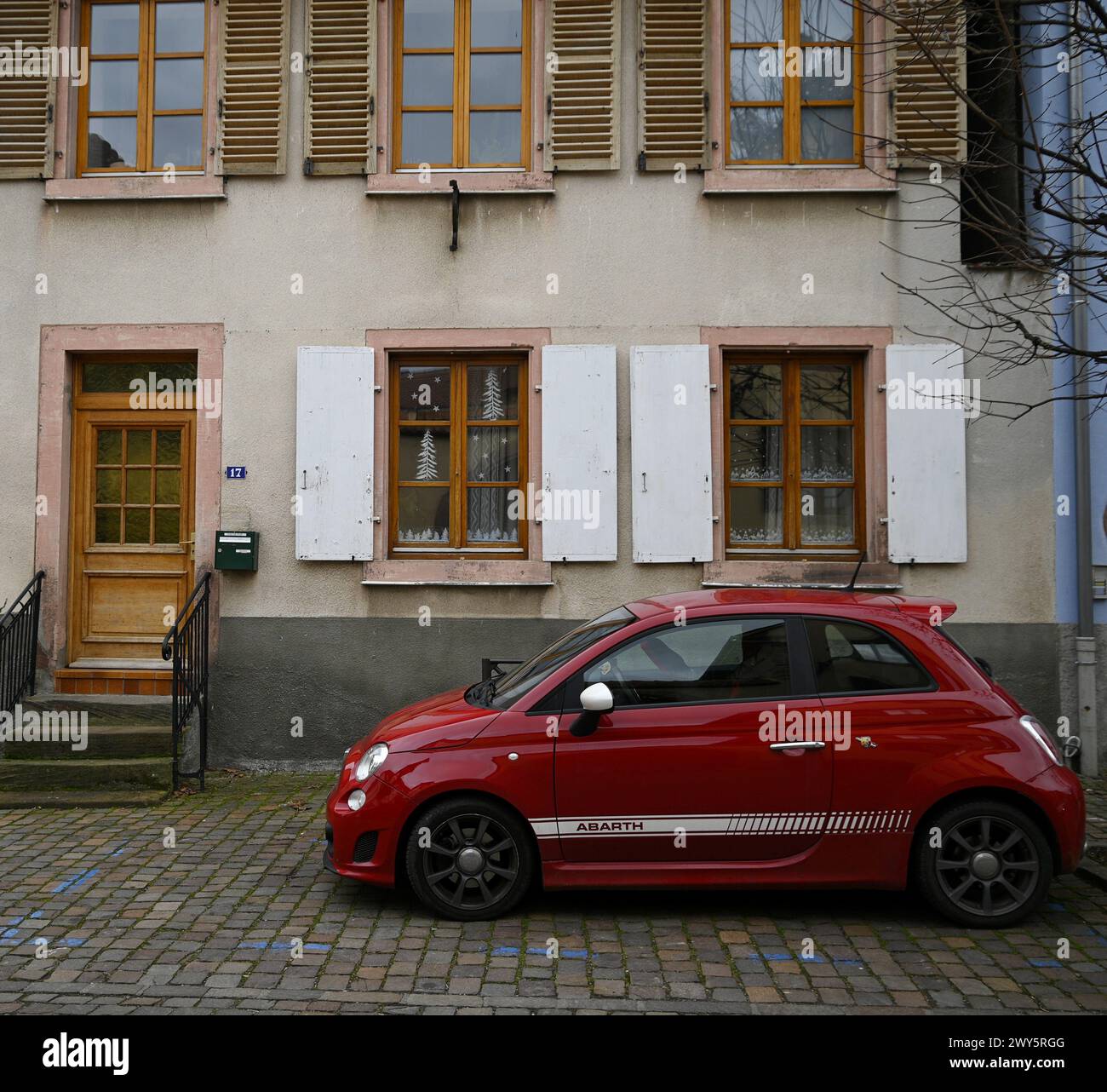 Landscape with scenic view of a red Fiat 500 Sport on the streets of ...