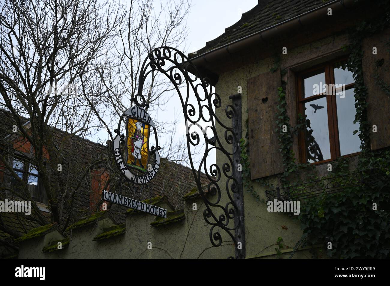 Antique handcrafted forged iron sign of a local shop in Bergheim, Alsace France. Stock Photo