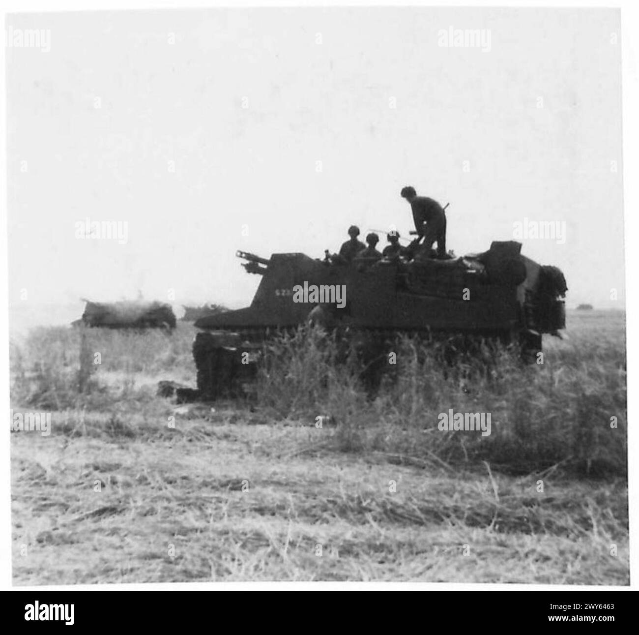 NORMANDY - VARIOUS - Self propelled guns in action in a cornfield beside the Caen-Troarn road. They are firing on Cagny. , British Army, 21st Army Group Stock Photo