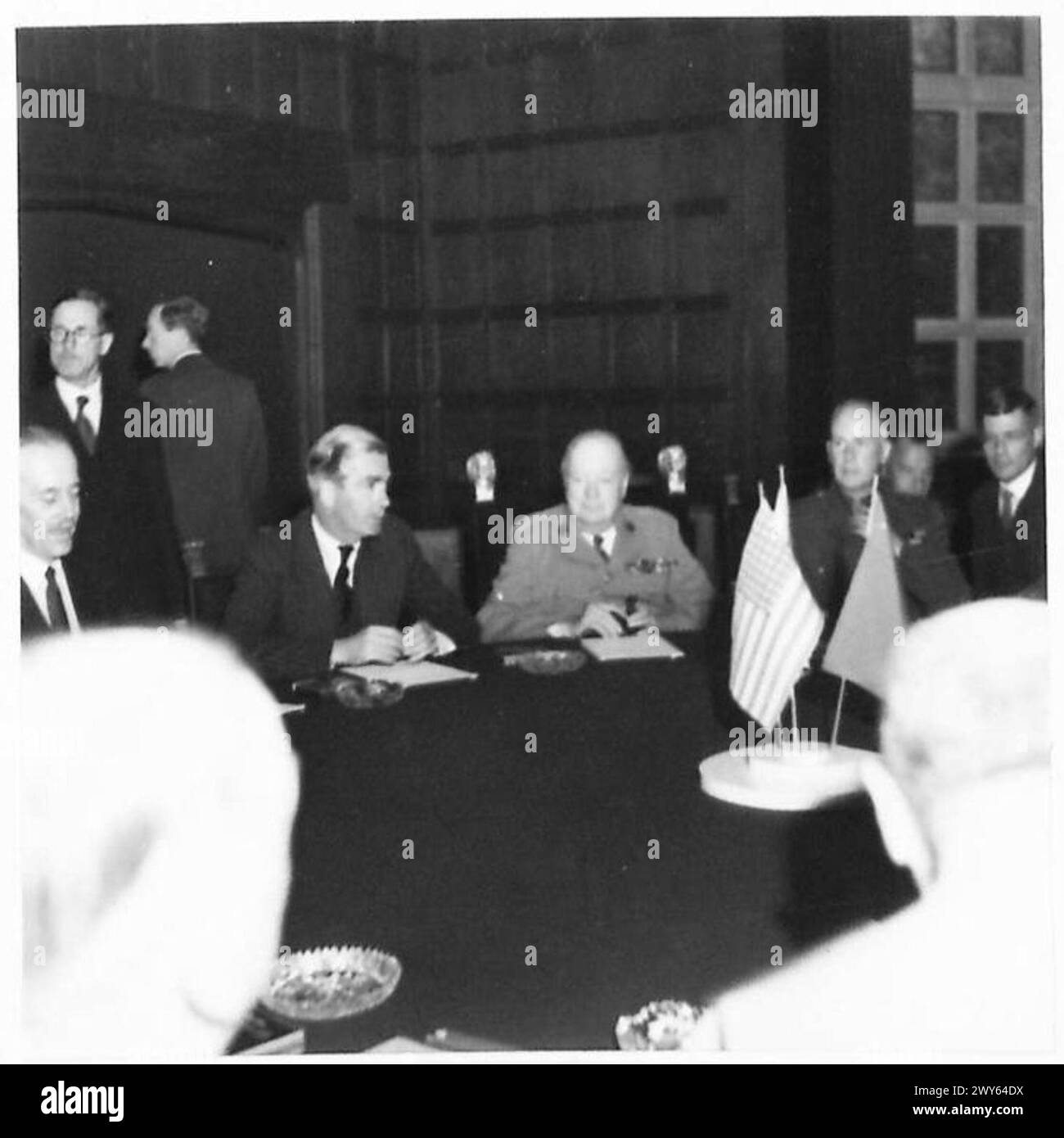 BIG THREE CONFERENCE Mr Churchill and Mr Eden seated at the BIG THREE CONFERENCE Mr Churchill and Mr Eden seated at the