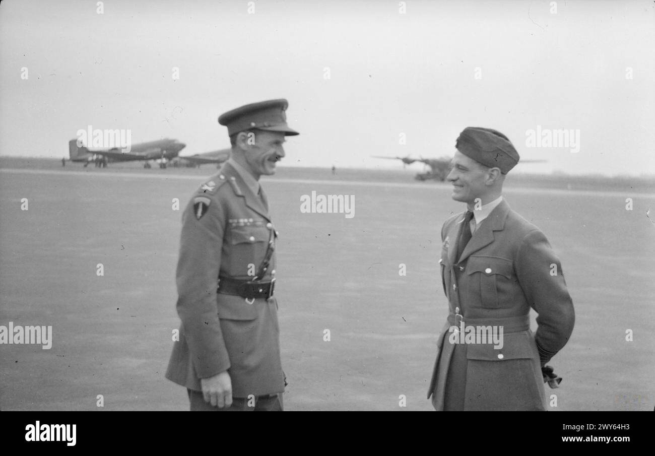 VISIT OF AIR CHIEF MARSHAL TEDDER TO COPENHAGEN - Major General Dewing and Group Captain J.E Johnson, D.S.O., (twobars) D.F.C and bar, O.C. 125 Wing, R.A.F., await the Air Chief Marshal. , Stock Photo
