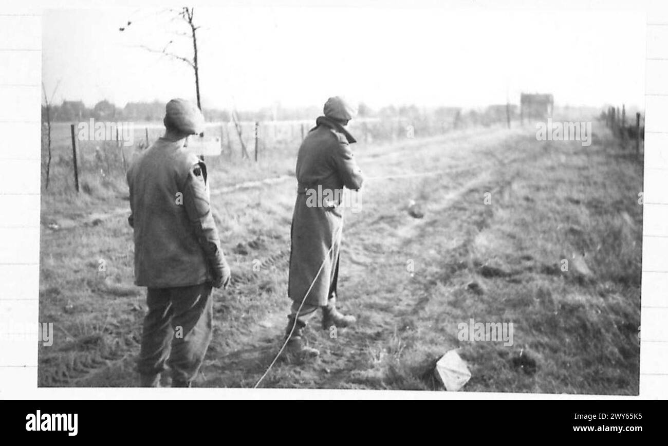 A British Army sapper removes a landmine from the ground using a 100 ...