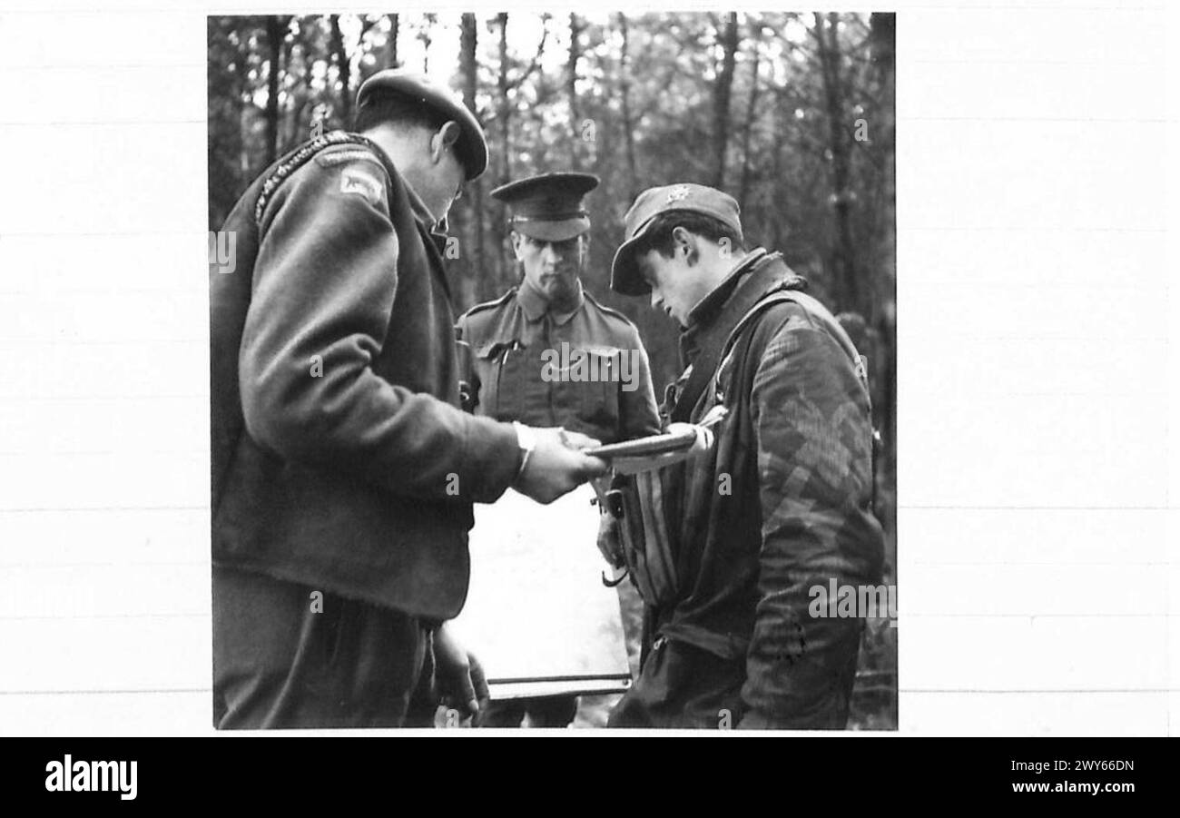 GERMAN PRISONERS. - A captured Paratrooper willingly gives information to a British Intelligence Officer. , British Army, 21st Army Group Stock Photo