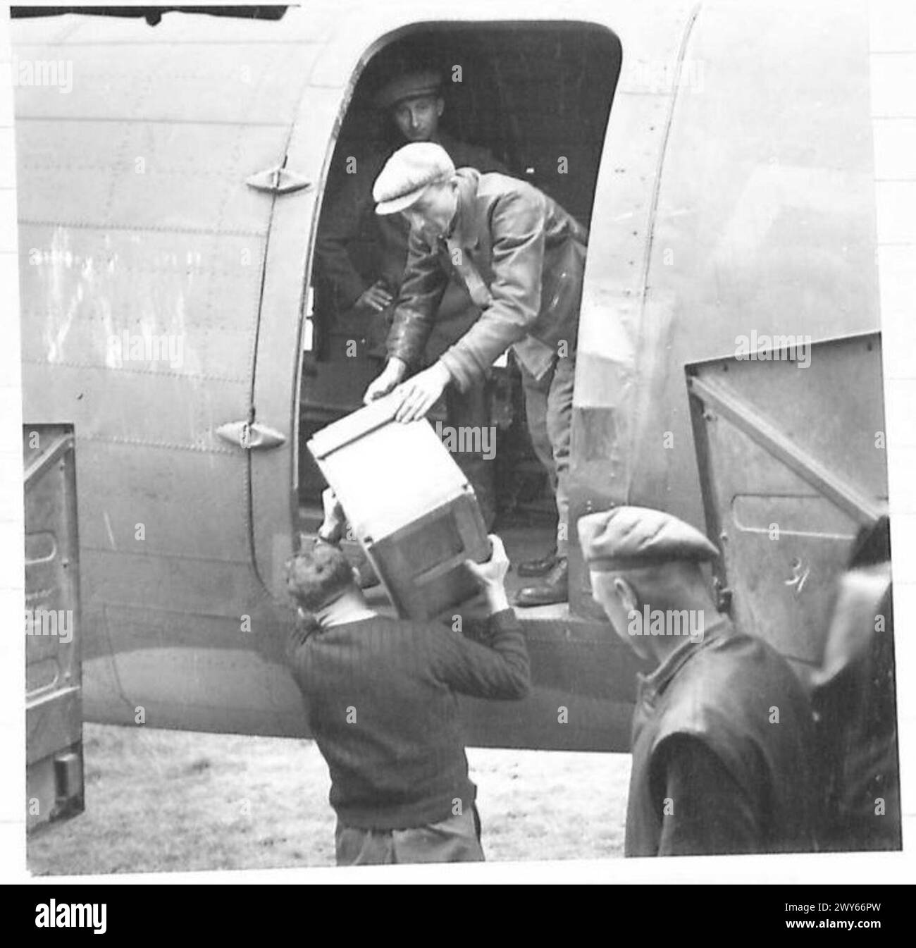 Open Rations British Army Local labour unloads rations from an aircraft for the R.A.S.C. during ...