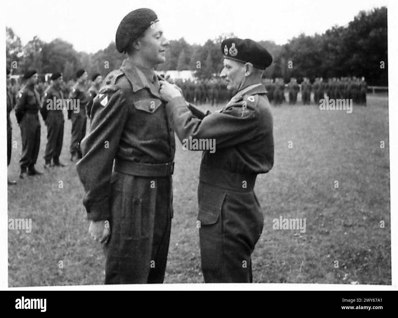 INVESTITURE CEREMONY FOR MEN OF THE 6TH GUARDS ARMOURED BRIGADE