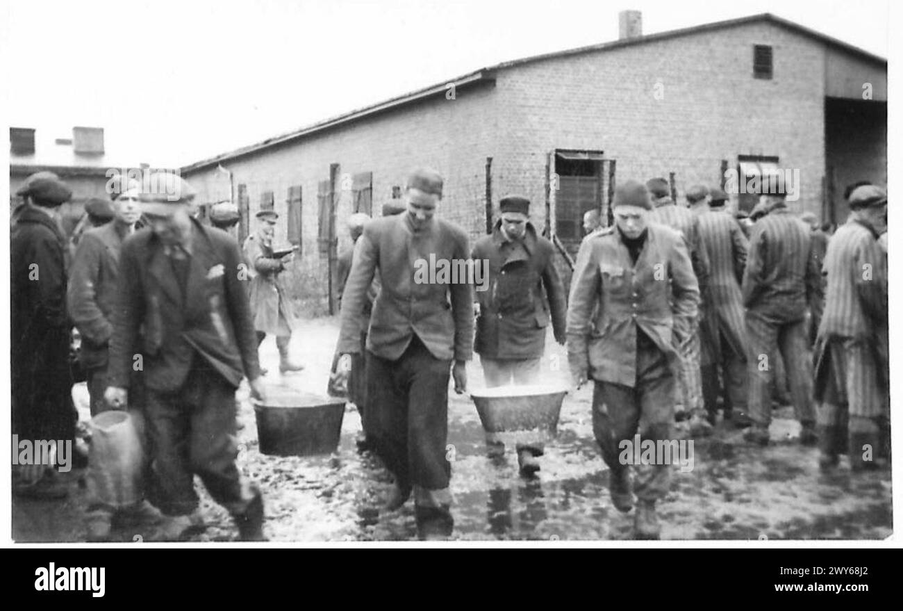 BRITISH TROOPS OVERRUN NEW P.O.W. & POLITICAL PRISONER CAMP AT SANDBOSTEL - Other political prisoners carrying in tubs of soup to their less fortunate comrades who are unable to walk. , British Army, 21st Army Group Stock Photo