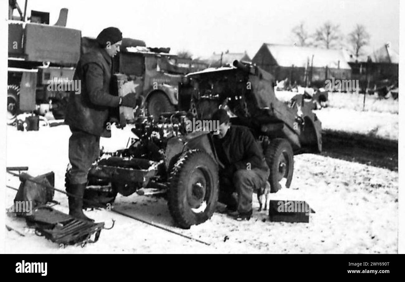 NEW JEEPS FROM OLD - (L to R) Cfn J.T. Mein, of Carlisle, removes a radiator while Cfn C. Pollard, of Dewsbury, works on a broken mudguard. , British Army, 21st Army Group Stock Photo