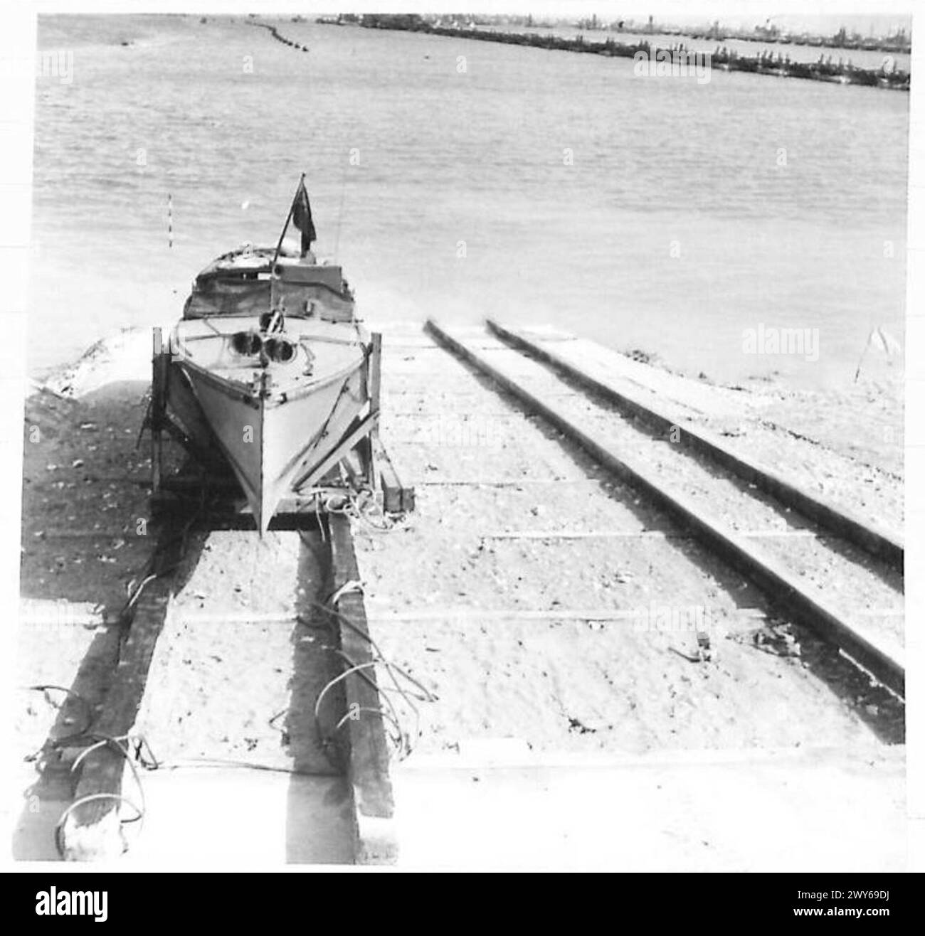 A launch lands on a concrete ramp at a prefabricated port used by ...