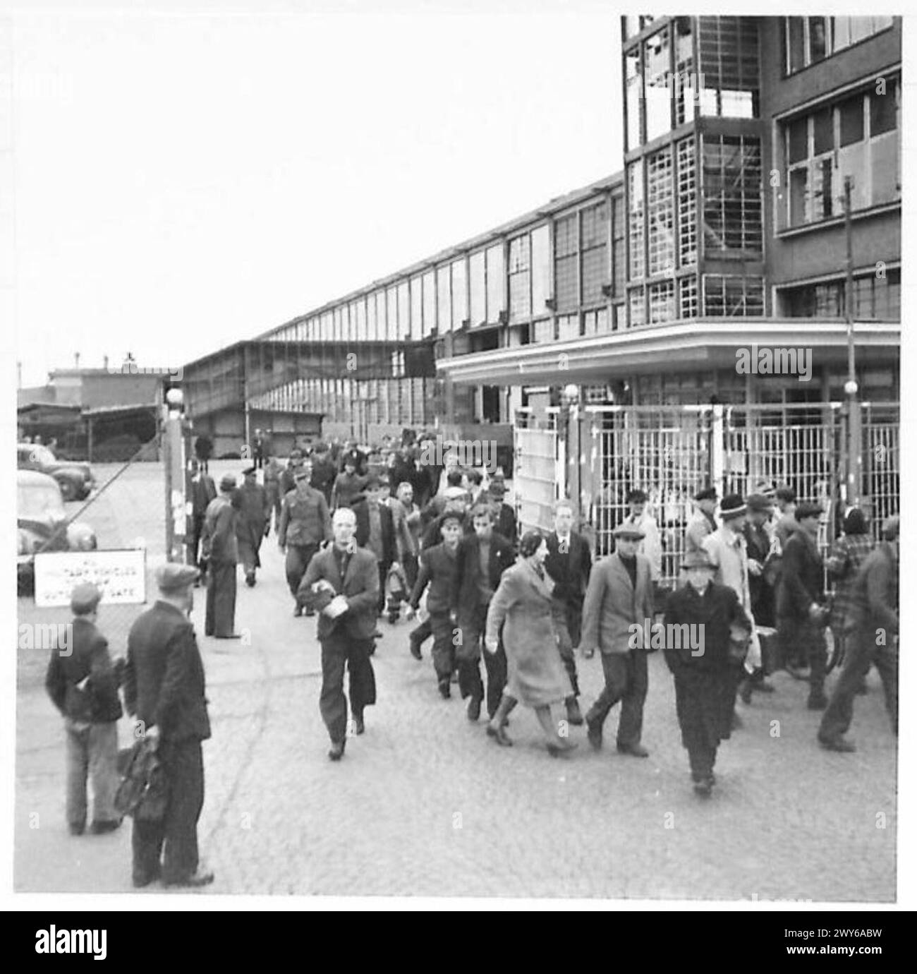 FORD WORKS AT COLOGNE - This plant employs about 2,500 workers, has a five-and-a-half day week and an eight hour working day. Average wage is about one-and- a-half marks per hour. Sharp on four o'clock the workers swarm out of the factory. , British Army of the Rhine Stock Photo