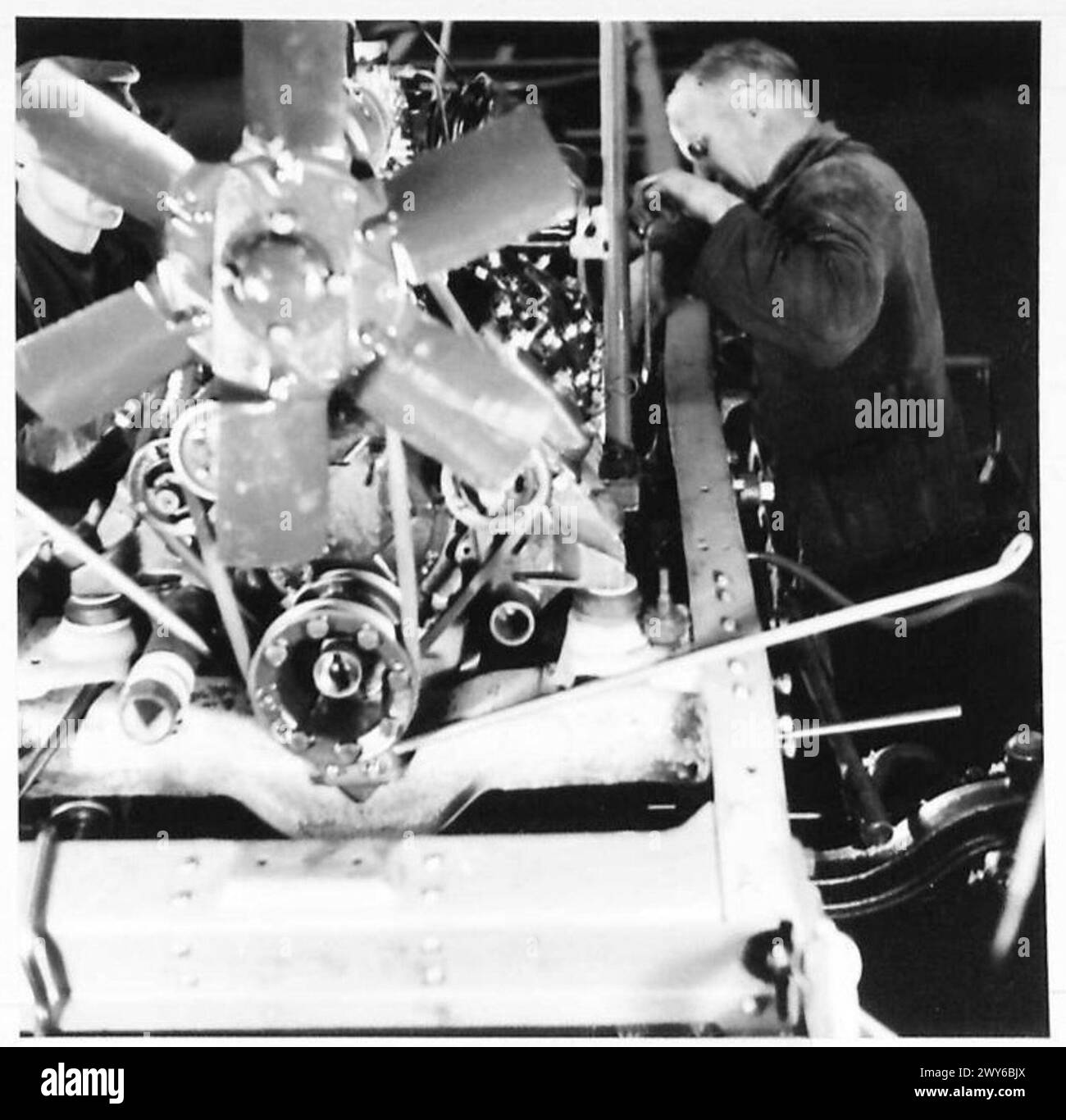 At Ford Works in Cologne, engines are installed into chassis as part of ...