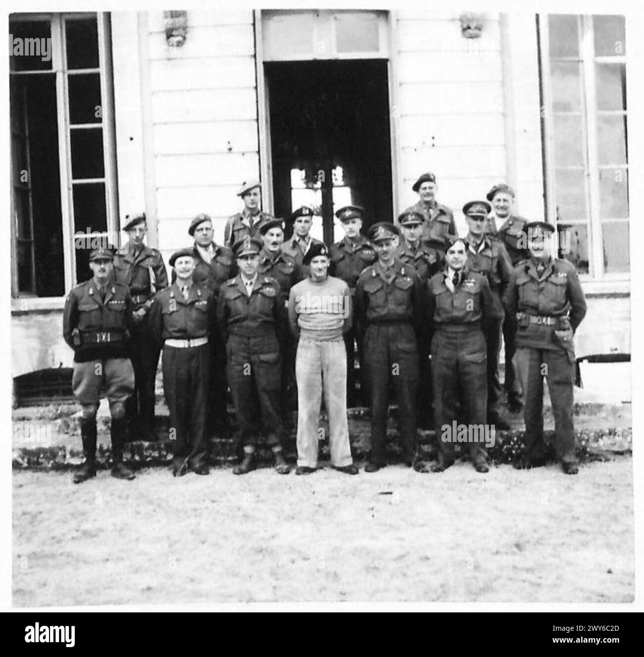 GENERAL MONTGOMERY WITH HIS COMMANDERS - Group showing General Montgomery with his Commanders. Major General Keller, 3 Canadian Division; Lieut.-General G. C. Bucknall, 30 Corps; Lieut.-General Crerar, 1 Canadian Army; General Sir Bernard Montgomery, 21 Army Group; Lieut.-General M. C. Dempsey, 2 British Army; A. V. Marshall Broadhurst, 83 Group TAF; Lieut.-General Ritchie, 12 Corps; Major General Thomas, 43 Division; Major General D. A. H. Graham, 50 Division; Lieut.-General Sir R. N. O'Connor, 8 Corps; Major General E. H. Barker, 49 Division; Lieut.-General J. T. Crocker, 1 Corps; Major Gene Stock Photo